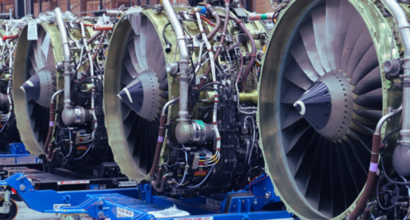 Aircraft engines lined up in an AerFin facility, supporting aftermarket parts supply and aviation asset management.