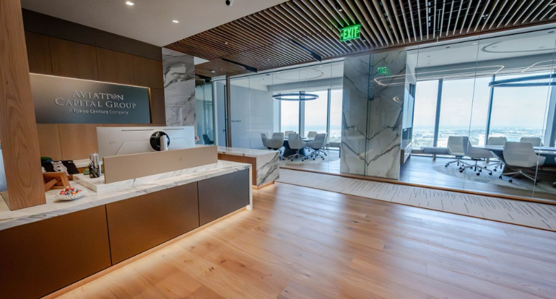 Reception area of Aviation Capital Group’s new Newport Beach headquarters featuring modern design and meeting spaces.