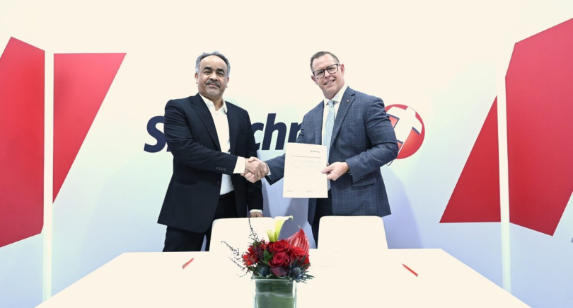 SR Technics and Oman Air executives sign a two-year engine MRO agreement.