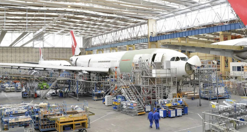 Widebody aircraft undergoes heavy maintenance inside an MRO hangar.
