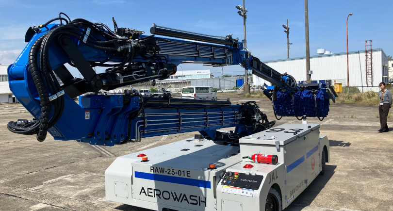 JAL Aerowash AW3 remote-controlled robot washing an aircraft at Narita Airport