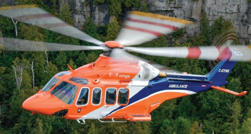 Ornge air ambulance helicopter in flight during critical care transport.