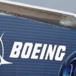 Boeing logo displayed on an aircraft engine and fuselage.