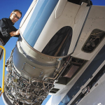 StandardAero technician inspecting an aircraft during MRO work