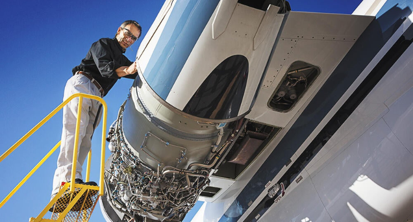 StandardAero technician inspecting an aircraft during MRO work