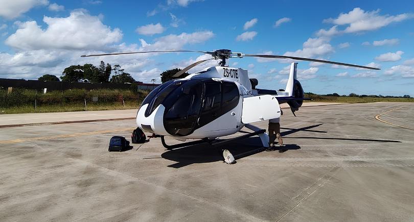 Airbus H130 helicopter delivering flood relief supplies in Mozambique