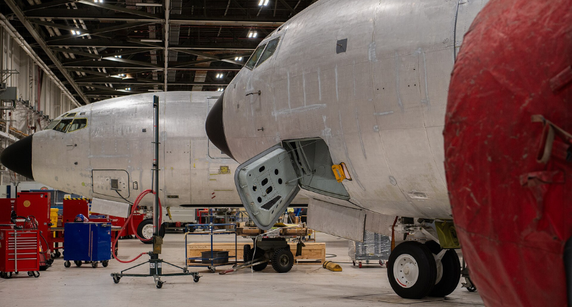 US Air Force aircraft undergoing maintenance inside a hangar