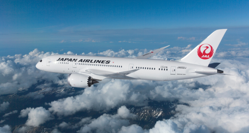 Japan Airlines Boeing 787 flies above clouds