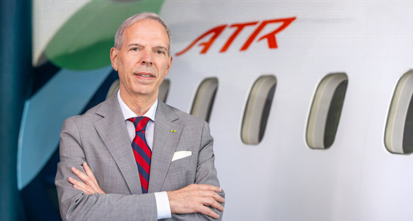 ATR executive standing beside an ATR aircraft