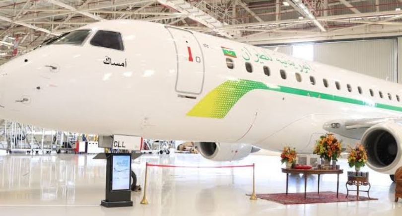 Mauritania Airlines Embraer E175 aircraft displayed indoors