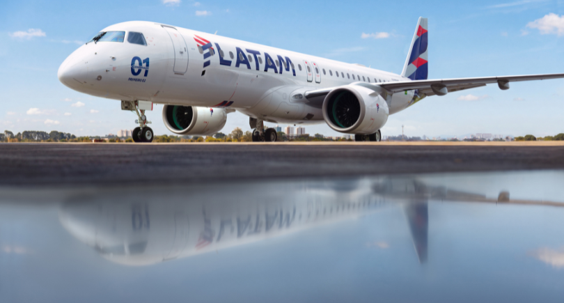 LATAM Airlines Embraer E195-E2 aircraft positioned on an airport runway