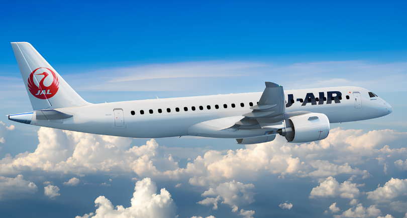 J-AIR Embraer E190-E2 aircraft flying above the clouds.