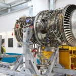 Rolls-Royce Trent XWB engine undergoing maintenance in an aircraft engine workshop.