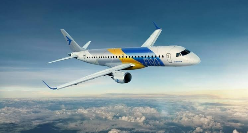 Embraer E190 regional jet flying above clouds following FL Technics' service appointment.