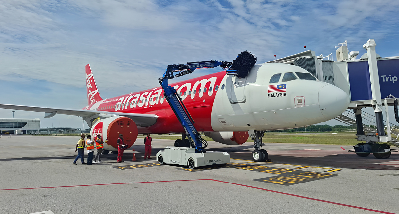 AirAsia aircraft being cleaned using the Aerowash AW3 automated washing system